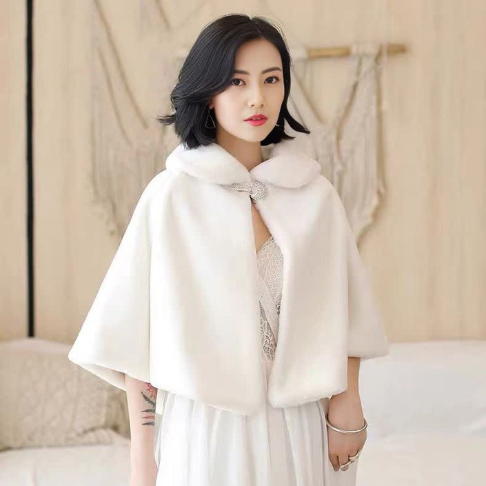 White cape with bow clasp, short sleeves, high collar