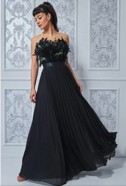Strapless black maxi dress with feathered bodice and flowing pleated A-line skirt