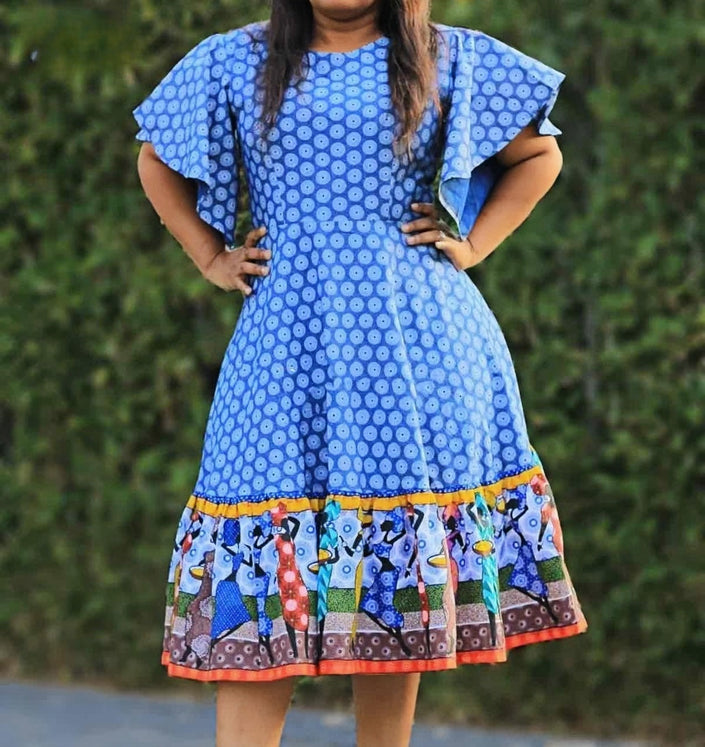 Blue mixed print knee dress with wide sleeves and multicolor border hem