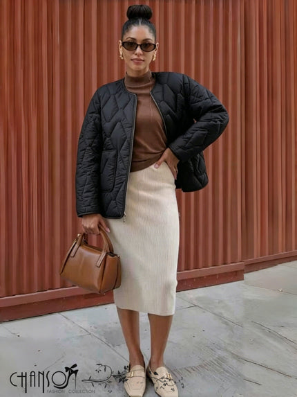 Black quilted collarless jacket with front zipper and diamond stitch quilting