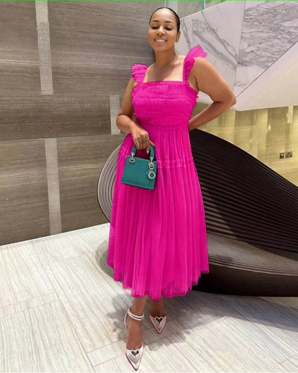 Hot-pink sleeveless tiered ruffle midi dress with smocked bodice and layered tulle skirt