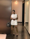 Light sleeveless mini dress with gold buttons and waist belt