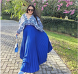 Blue pleated maxi skirt with blue-and-white printed blouse top, long sleeves