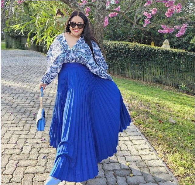 Blue pleated maxi skirt with blue-and-white printed blouse top, long sleeves