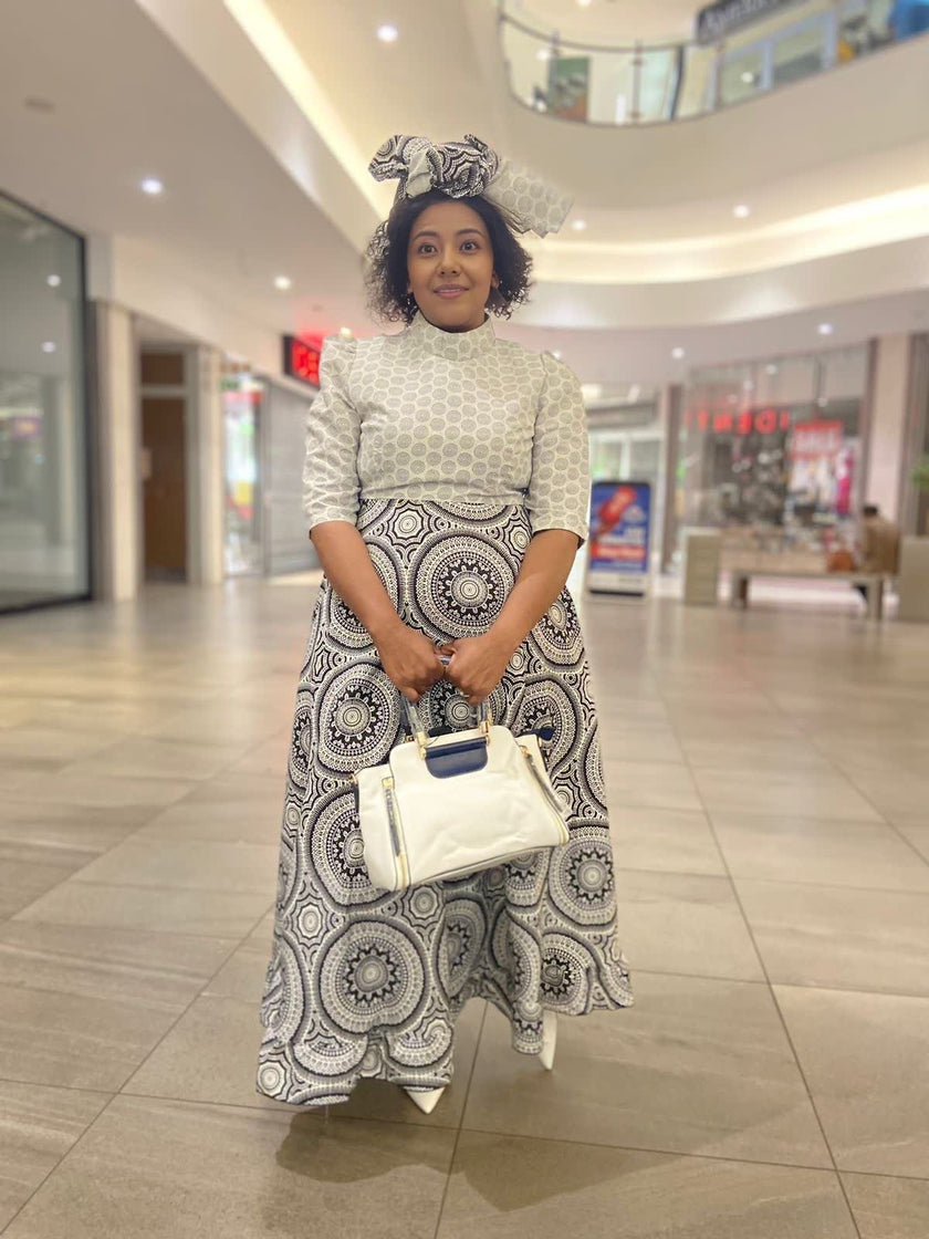 Traditional Flared Skirt Dress with Fitted Bodice and Circular Pattern Design