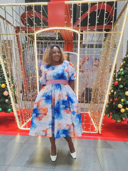 Plus size floral midi dress, blue-and-orange print with ruffle hem and puff sleeves