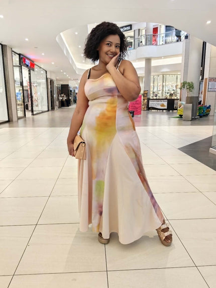 Gradient maxi dress with spaghetti straps, fitted bodice, and flowing pastel skirt