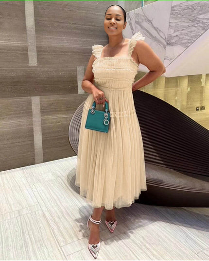 Beige sleeveless tiered ruffle midi dress with smocked bodice and layered tulle skirt