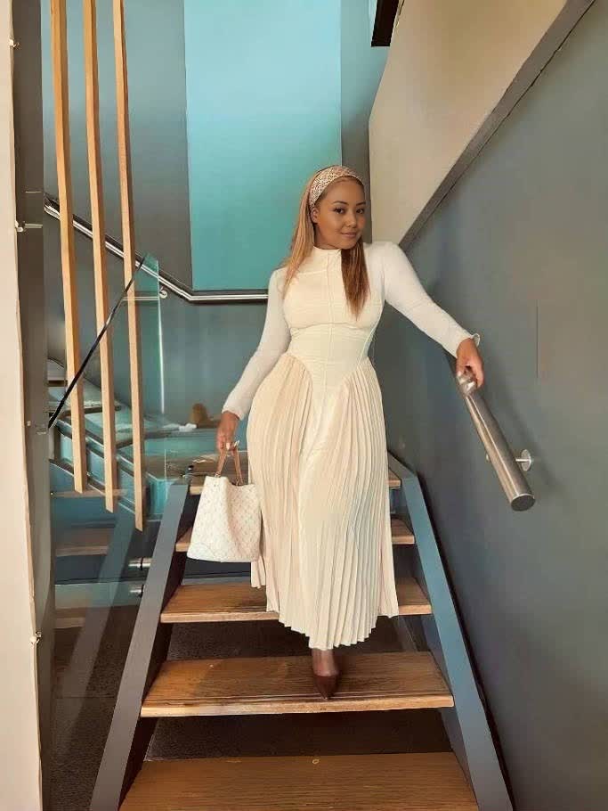 Beige pleated midi dress with long sleeves and cinched stretch waist
