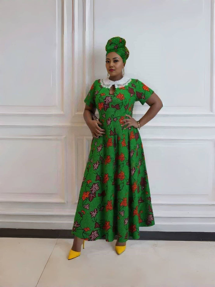 Green floral maxi dress with lace collar detail, short sleeves and gathered skirt