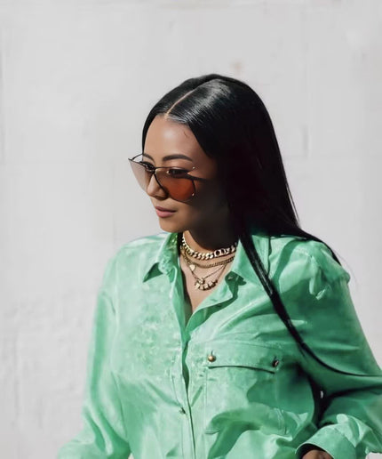 Green button-front twin set top with chest pockets and long sleeves