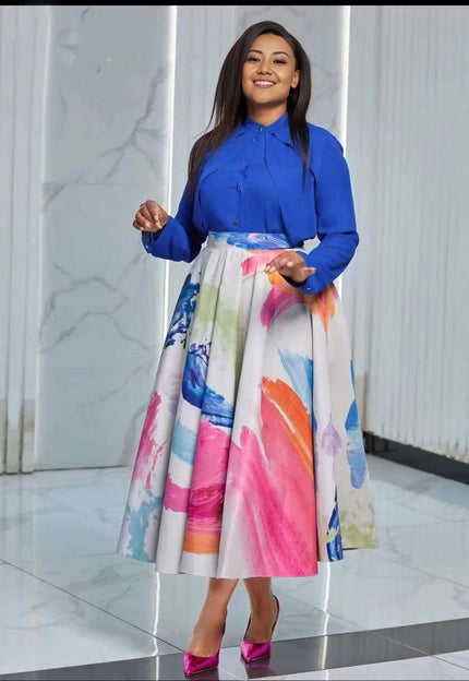 Blue long-sleeve button shirt with colorful watercolor midi skirt