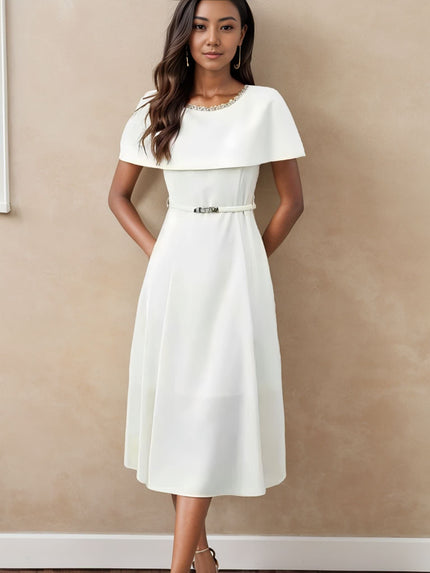 White midi dress with chain neckline, short sleeves, and waist belt detail
