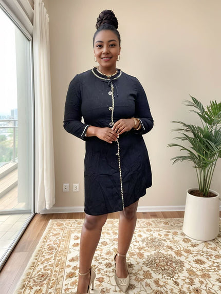Dark navy pearl-button dress with flap collar, long sleeves, gold trim