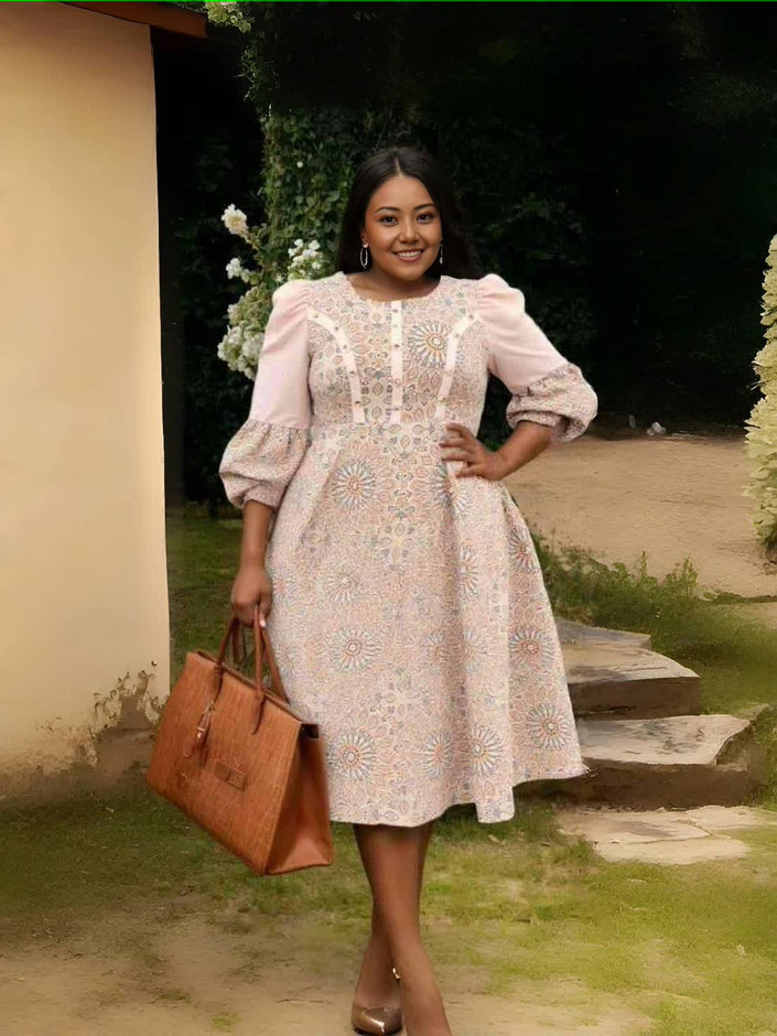 Floral midi dress with puff sleeves and pleated waist, pale pink with embroidered motifs