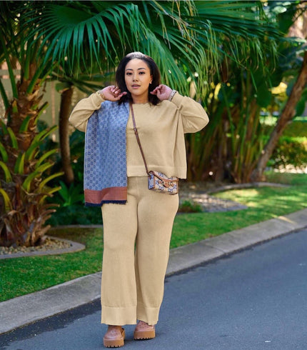 Tan knit twin set with short cardigan, matching scarf, and wide-leg loose pants