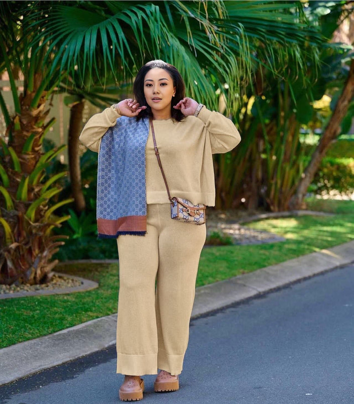 Tan knit twin set with short cardigan, matching scarf, and wide-leg loose pants