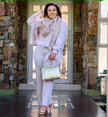 Light-purple knit twin set with short cardigan, matching scarf, and wide-leg loose pants