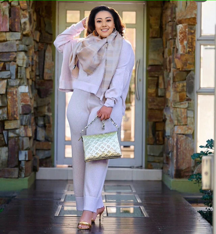 Light-purple knit twin set with short cardigan, matching scarf, and wide-leg loose pants