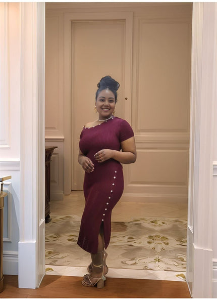 Maroon one-shoulder knit midi dress with side buttons down front, slit hem