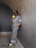 Grey zip-front jacket and wide-leg striped pants set