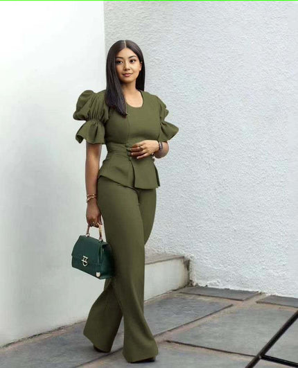 Army-green puff-sleeve twin set with cropped peplum top and wide-leg pants.