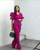 Magenta puff-sleeve twin set with cropped peplum top and wide-leg pants.