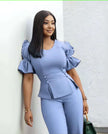 Sky-blue puff-sleeve twin set with cropped peplum top and wide-leg pants.