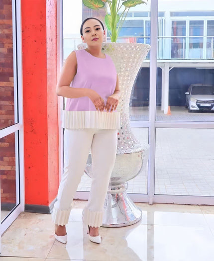Light ivory fringe pant with straight slim-leg fit and scalloped hem detailing