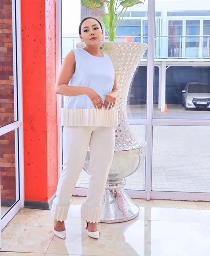 Light ivory fringe pant, slim straight legs with scalloped hem for a textured look