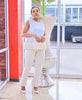 Light ivory fringe pant, slim straight legs with scalloped hem for a textured look