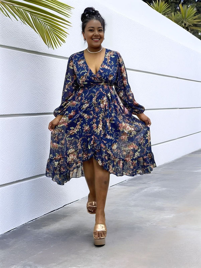 Navy floral midi dress with V-neck, puff sleeves, and ruffled hem
