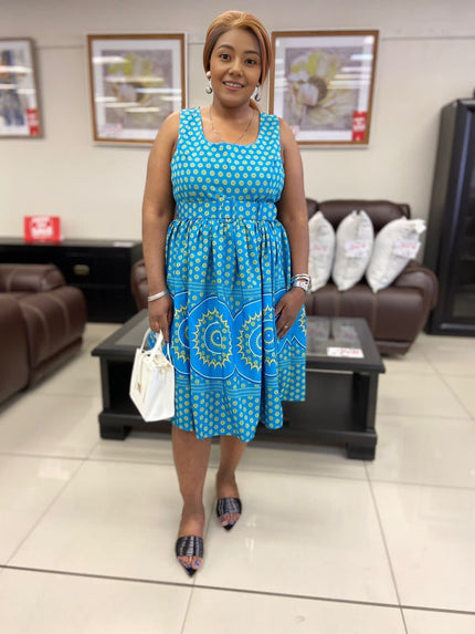 Blue patterned midi dress with square neckline and cinched waist detail