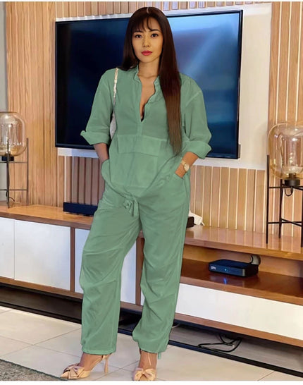 Dark-cyan solid jumpsuit with front placket and drawstring waist, long sleeves