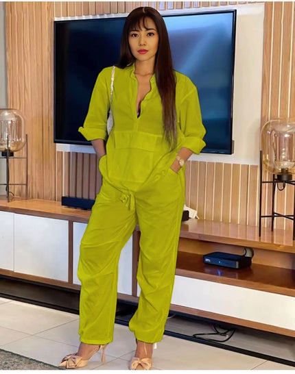Green-yellow solid color jumpsuit with front placket and drawstring waist, long sleeves