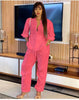 Hot-pink solid jumpsuit with V-neck, quarter sleeves, drawstring waist, front pocket