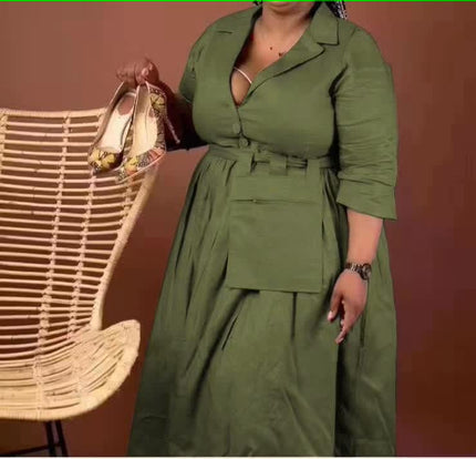 Dark-green belted midi dress with pointed collar, V-neck, and three-quarter sleeves