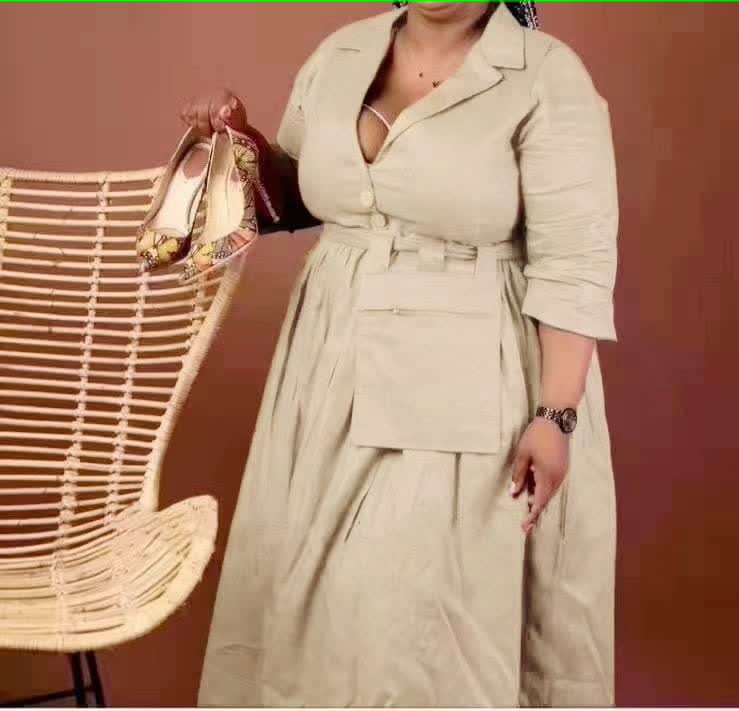 knee-length dress with a collar, waist belt, button details, and pockets