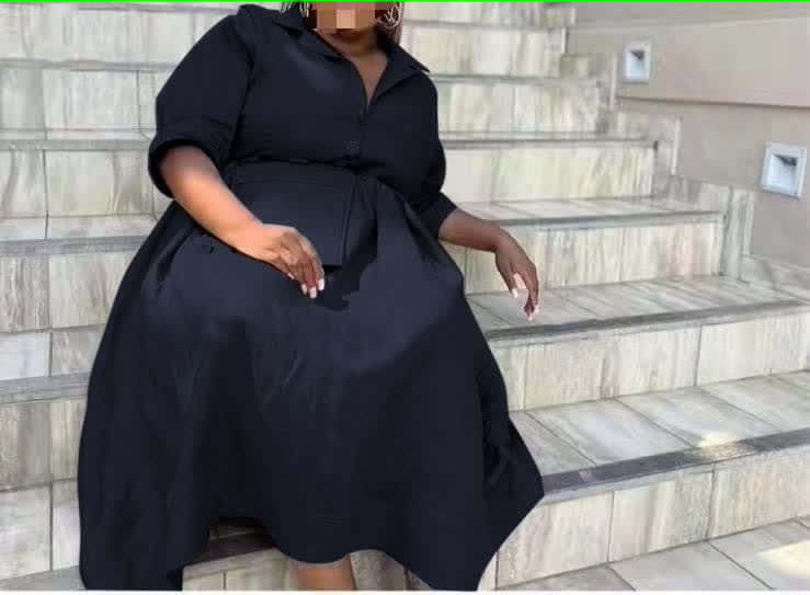 knee-length dress with a collar, waist belt, button details, and pockets