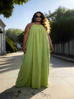 Yellow-green sleeveless maxi dress with gathered neckline and full-length skirt