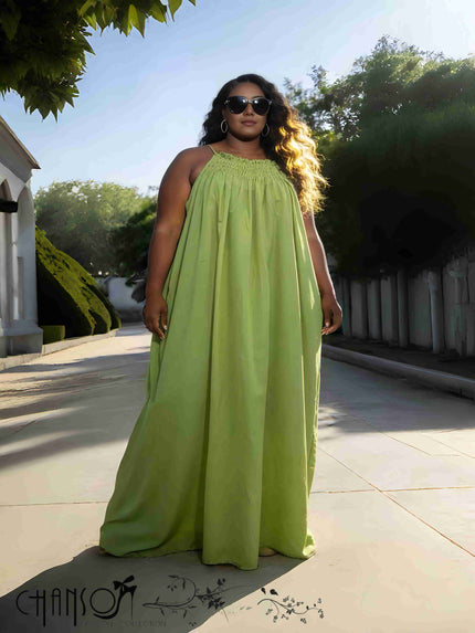 Yellow-green sleeveless maxi dress with gathered neckline and full-length skirt