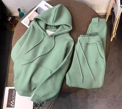 Mint-green hoodie and matching sweatpants set with drawstring hood and ankles