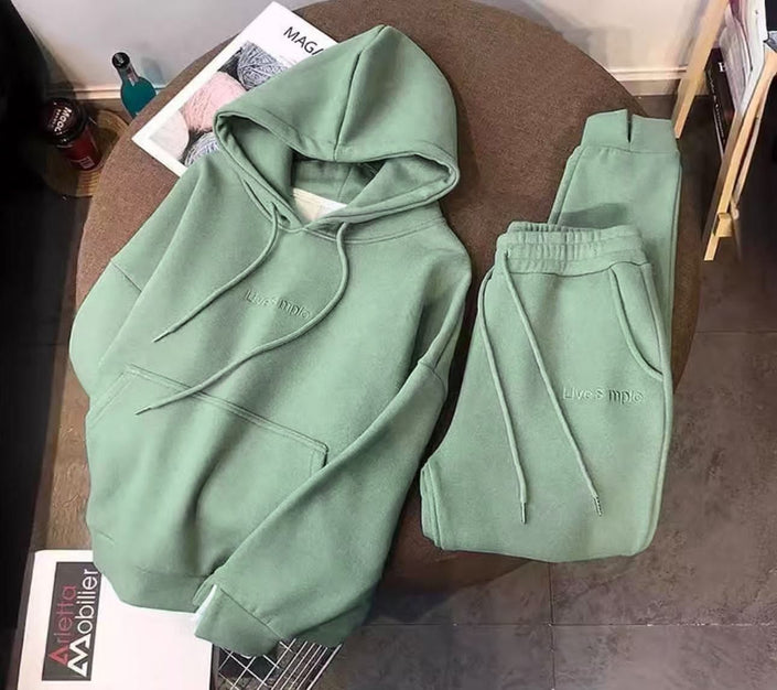 Mint-green hoodie and matching sweatpants set with drawstring hood and ankles