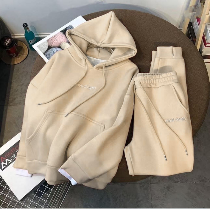 Cream hoodie and matching sweatpants set with drawstring hood and cuffed ankles