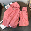 Pink hoodie and matching sweatpants set with drawstring hood and ankle cuffs