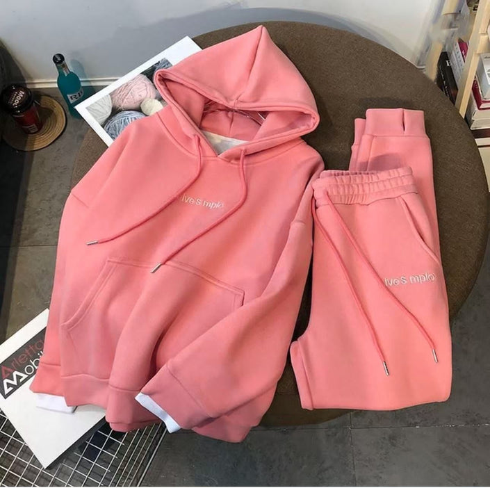 Pink hoodie and matching sweatpants set with drawstring hood and ankle cuffs