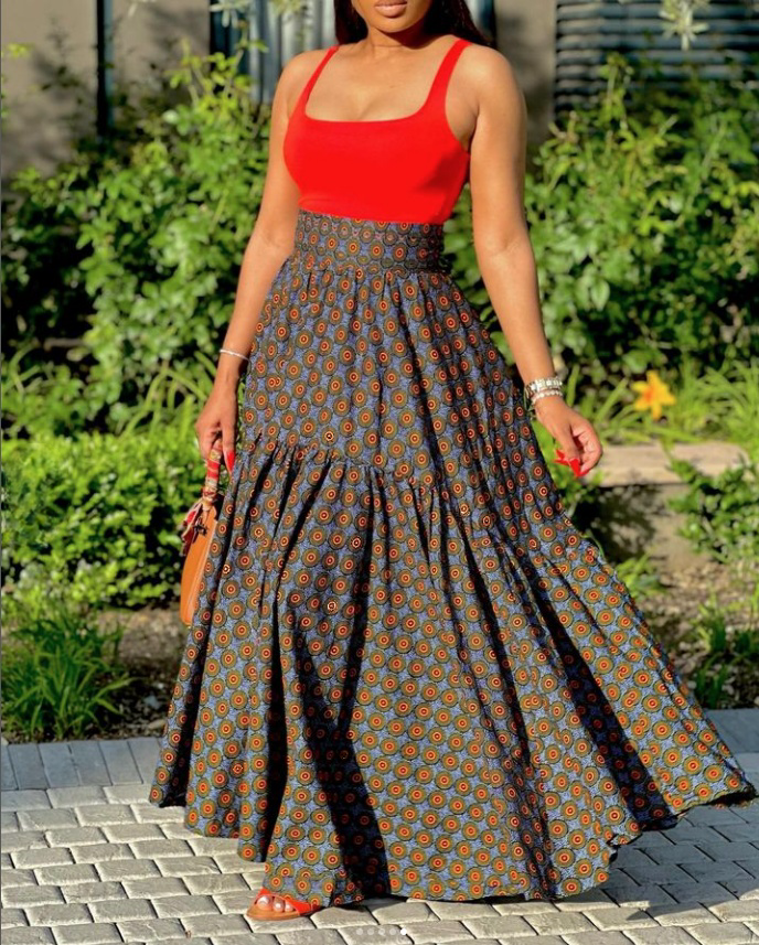 Sleeveless red tank top and patterned maxi skirt twin set with wide waistband