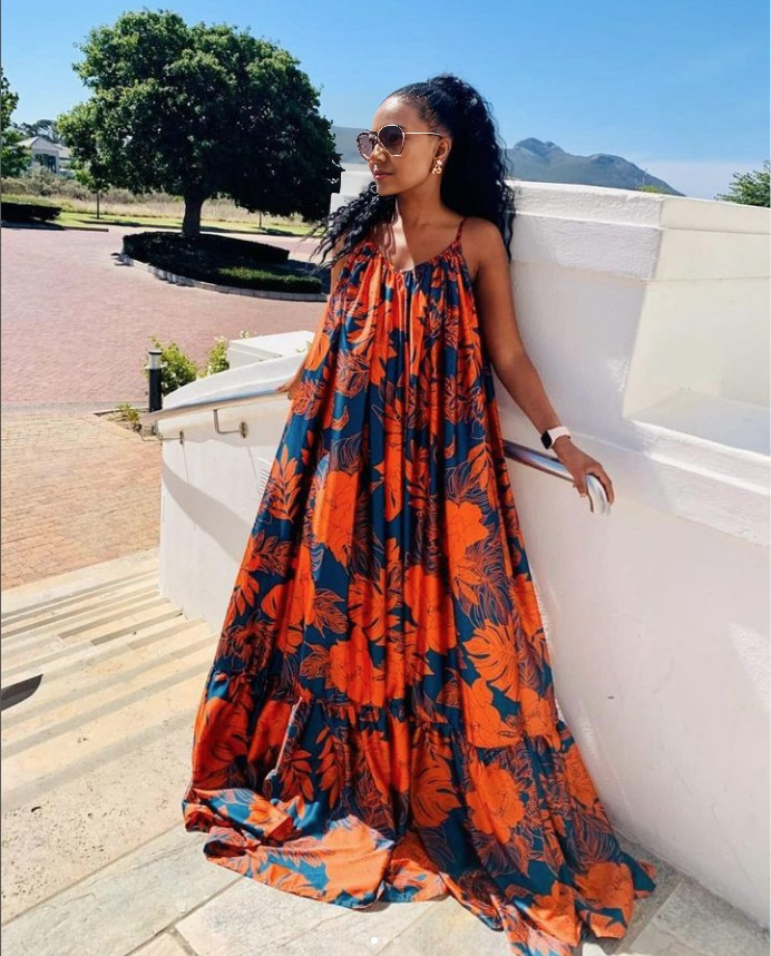Floral maxi dress with ruffled hem, sleeveless, orange and blue pattern