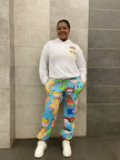 White cartoon hoodie set with blue character-print pants, pullover hood and drawstrings.