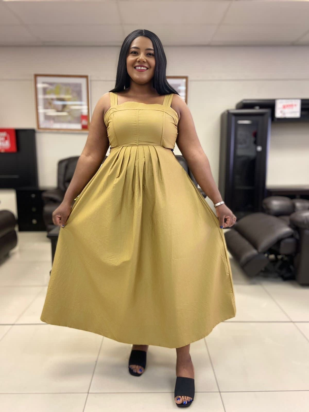 Yellow pleated midi dress with fitted bodice and full skirt, wide shoulder straps